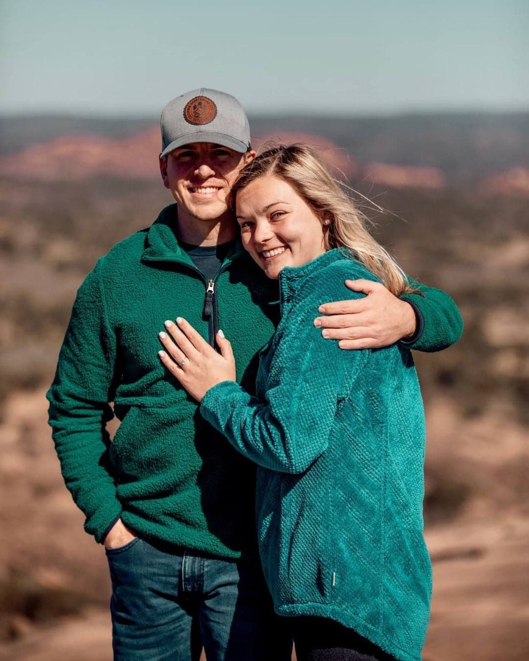 A couple outdoors after saying yes